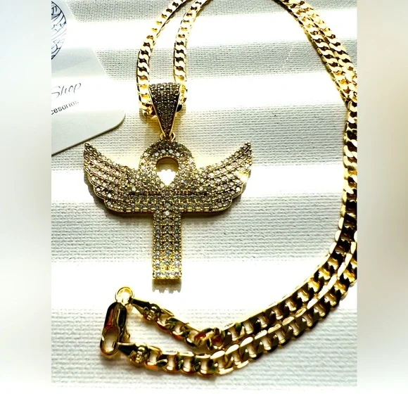 Cuban link chain with ansata cross pendant and wings polished in zirconia.